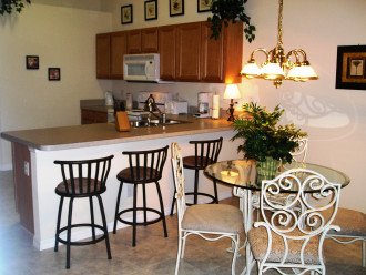 Breakfast nook with a very efficient and full service kitchen.