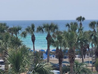 Gulf view from your balcony. Blue umbrellas at gulffront pool