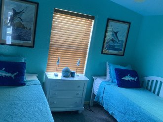 Turquoise room, 2 day beds, one trundle under one of the beds.