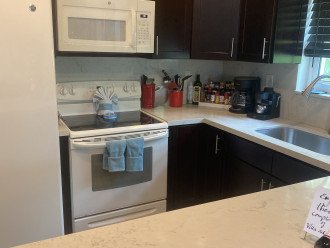 Fully equipped kitchen with new appliances.