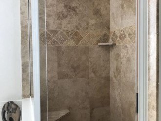 Beautiful Travertine Master Shower with awesome views of the beach