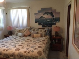 Master bedroom with original dolphin and handcrafted lamps