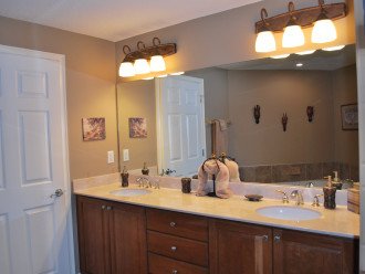 Double vanity in the master bath next to the double shower
