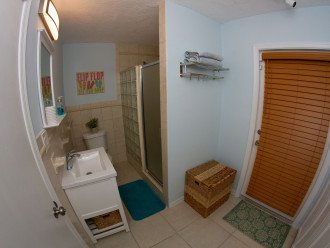 Master Bathroom with walk in shower and door to outdoor covered patio