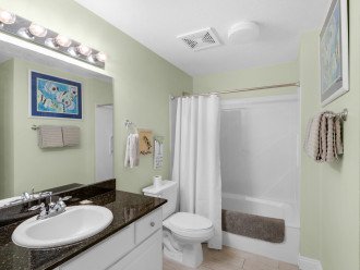Large guest bathroom with tub/shower combo, lots of counter space & storage~ Enter from the main hall or private entry to 2nd guest bedroom.