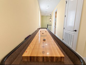 3rd floor shuffleboard table and private hall bathroom