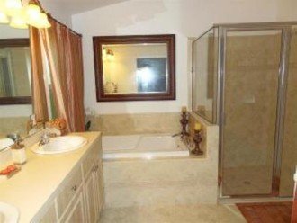 Master en-suite with large bath and walk -in shower room and separate toilet