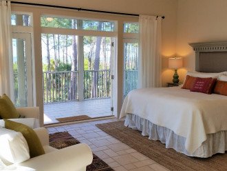 Master suite with seating area and private screened porch with wonderful view.