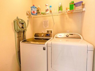 Washer, dryer, iron and ironing board with laundry detergent and fabric softener provided