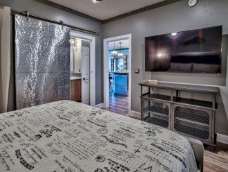 Guest King Bedroom with metal barn door access to en suite bath