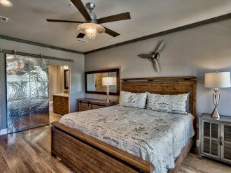 Master King Bedroom with metal barn door to en suite bath