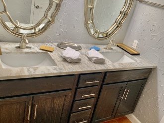 Master bath has double sinks, granite vanity top