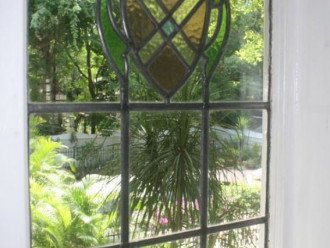 Antique stained glass in most windows.