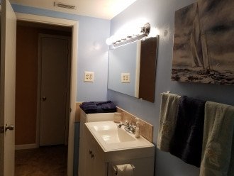 Full bathroom with tub and shower.