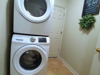 Laundry room with full size units.