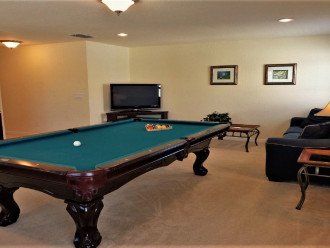 Games Room with AC, Air Hockey Table , 42" TV and comfortable Seating area.