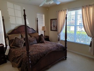 Master King Bedroom with TV and Double Master Suite leading to Pool.