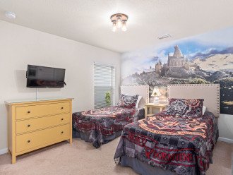 This Harry Potter inspired bedroom is sure to charm any young wizards!