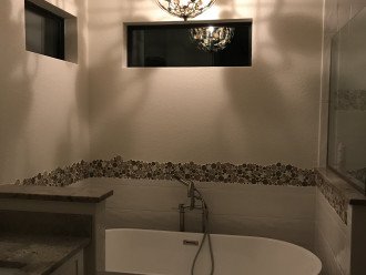 Soaker bathtub with chandelier