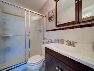 Master bedroom bathroom with tiled shower and new vanity with lots of storage