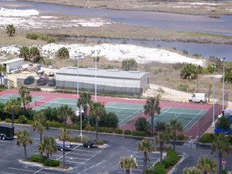 FOUR LIGHTED TENNIS COURTS