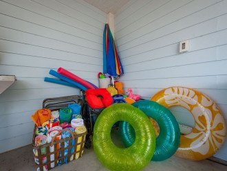 Lots of pool and beach toys, along with a cart!