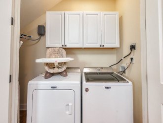 Laundry room off kitchen. There is also a stroller and pack n play!