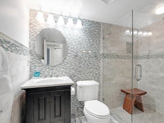 Updated Guest Bathroom With Glass and Tile Shower
