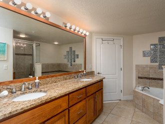 Master bathroom with tub, shower and large closet