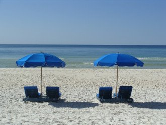 The beach lounges & umbrella, provided to our guests