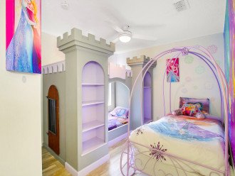 This princess room features a custom made princess castle bed.