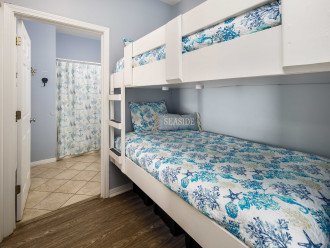 Built-in twin bunk bed with a hallway blackout privacy curtain.