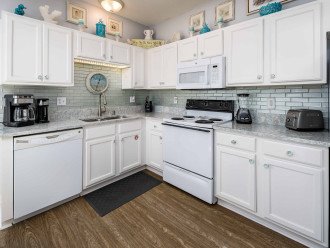 Kitchen w/ quartz countertops, appliances and tools you need to create meals
