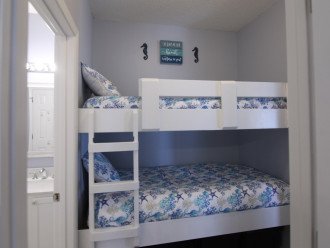 Built-In twin bunk bed sleeps two children, or even one adult on the bottom