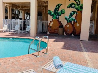 Outdoor shower, pool bathroom, beach towels provided in each condo.