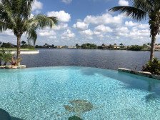 Serenity’s Edge-Luxury NW Spreader Waterfront Home, Panoramic Views,Gulf Access