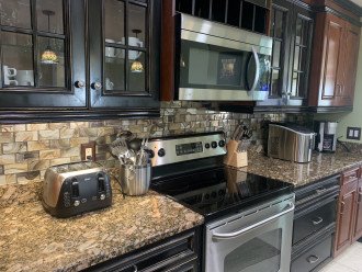 Beautiful Kitchen with Stainless Steel, Granite and Tile