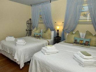 Designer Guest Bedroom with Elegant Canopied Beds, 1 Queen and 1 Full