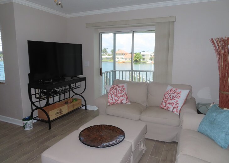 Living Room/Television area with view to screened porch.