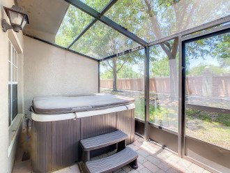 screened patio with private hot tub