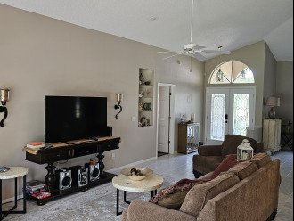 living room with 60 inch tv includes cable