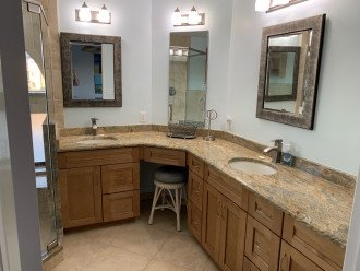 Dual sinks with plenty of cabinet space and mirrored medicine cabinet