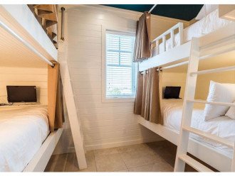 Bunk Room with 2 Sets of White Custom Built Twin over Twin Bunks