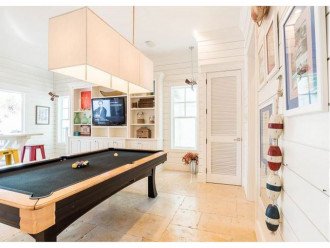 First Floor Game Room with Custom Built Pool Table and Wet Bar