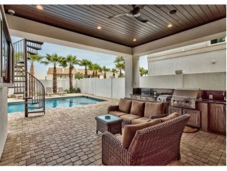 Enjoy a BBQ at your Private Poolside Summer Kitchen with Seating and Grill