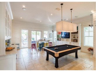 First Floor Game Room with Custom Built Pool Table and Wet Bar