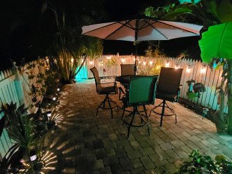 Outdoor lighting and seating for 4 on back patio