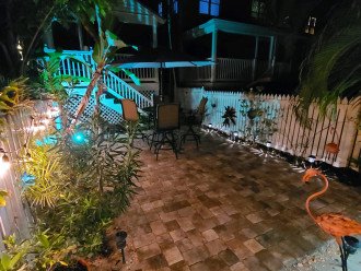 View of landscaped back patio at night