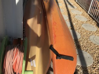 Two Kayaks with paddles, life vests, anchor, line, and seats ...