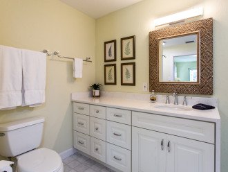 Master bathroom with walk-in shower and grab bar